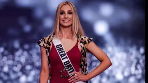 Menahem KAHANA/ AFP via Getty Images Miss Great Britain, Emma Collingridge, on stage during the swimsuit competition.