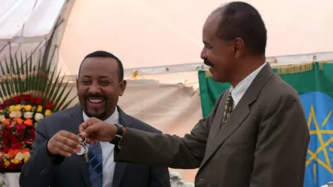 Getty Images Eritrean President Isaias Afewerki and Ethiopian Prime Minister Abiy Ahmed attend the inauguration ceremony of Embassy of Eritrea in Addis Ababa, Ethiopia on July 16, 2018.