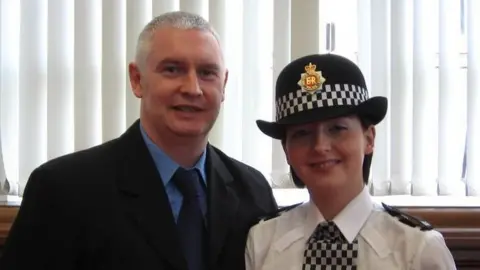 family handout Bryn and Nicola Hughes at a GMP ceremony