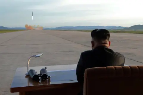 Reuters Kim Jong-un watches a missile launch from North Korea, 16 September