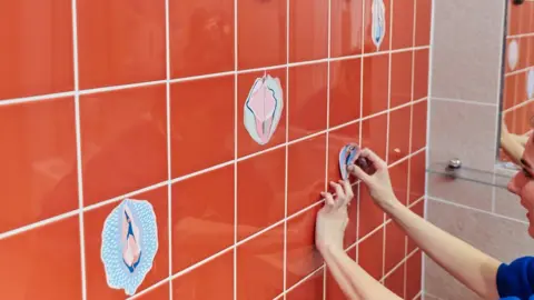 JACK LAWSON Small versions of the designs on bathroom walls.