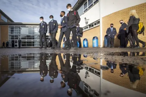 PA Media pupils arrive at school