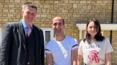 Wiltshire Council Yuksel and Alina with councillor Richard Clewer