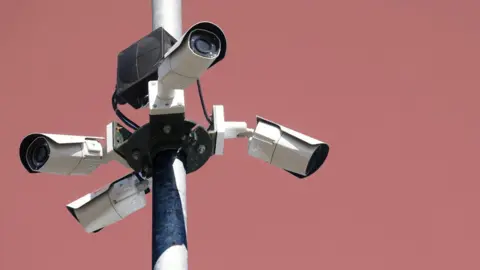 Getty Images A stock illustration of surveillance cameras