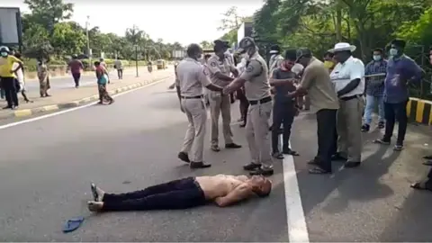 UGC The doctor lies on the road with his hands tied