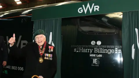 GWR/PA Wire Harry Billinge in front of a train with his name on it