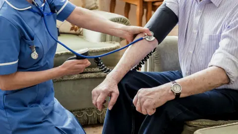 Getty Images Stock image of an elderly patient receiving care in their home