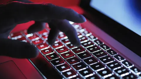 Getty Images Person typing on a laptop (stock image)