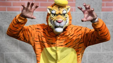 Getty Images A Bangladesh fan poses for a photo during the Group Stage match of the ICC Cricket World Cup 2019 between South Africa and Bangladesh on 2 June at The Oval in London.