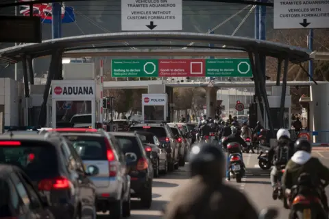 Getty Images Cars queue on the Gibraltar side of the Spanish border