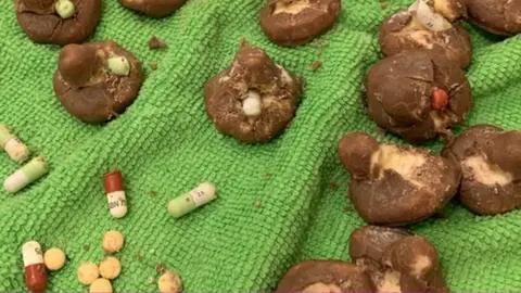 Gillian Chenery Mrs Chenery said the items appeared to be chocolate-covered marshmallows laced with painkillers.