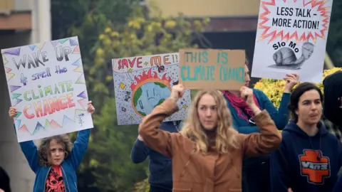 EPA Protesters rally outside as New South Wales Premier Gladys Berejiklian meets with Rural Fire Service Deputy Commissioner Rob Rogers at the Blue Mountains Fire Control Centre in Katoomba, Australia,