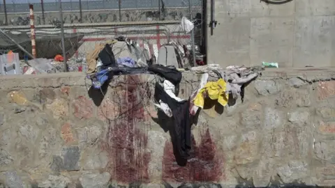 Getty Images Blood-stained wall outside Kabul airport