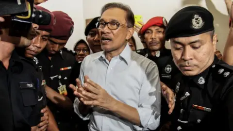 Getty Images Anwar Ibrahim pictured coming out of court in September 2016