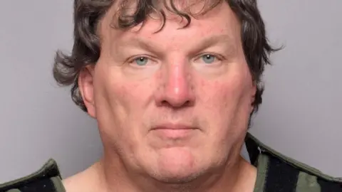 Reuters Rex Heuermann's mugshot at the Suffolk County Sheriff’s Office in Yaphank, New York, on 14 July 2023