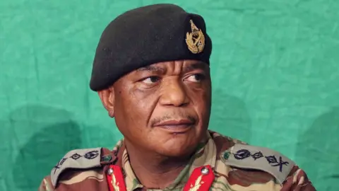 EPA Zimbabwe National Army commander Constantino Chiwenga addressing a press conference at the army headquarters in Harare, Zimbabwe, 20 November 2017. T