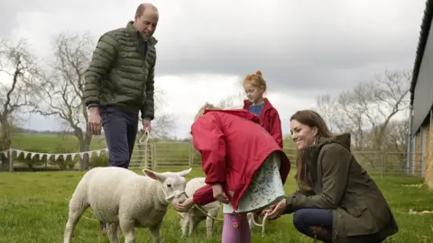 PA Media The Duke and Duchess of Cambridge with farmers daughters Clover 9, and Penelope Chapman, 7, during a visit to Manor Farm in Little Stainton, Durham