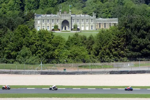 PA Media A view of Donington Hall as seen from Donington Park Race Circuit, Castle Donington, May 2019