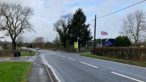 Martin Heath/BBC Road with marina signs visible in the background