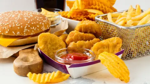 Getty Images Assortment of fast food including chips and burgers