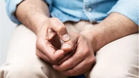 Getty Images Man's hands