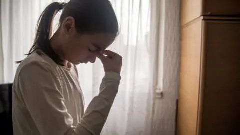 Getty Images Teenager with a headache