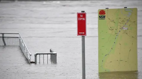 Getty Images Sign boards in flooded park