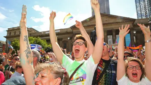 Getty Images Same-sex marriage supporters celebrating the result in Melbourne