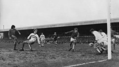 Getty Images George Best against Northampton Town