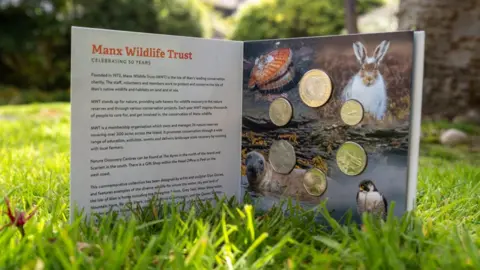 IOM GOVERNMENT The Manx Wildlife Trust Anniversary Collection in a display