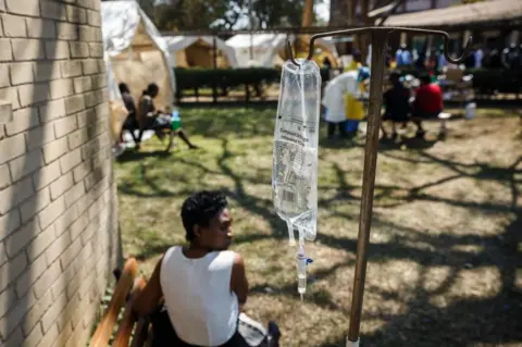 AFP A cholera patient waits for treatment during a visit of Zimbabwe Minister of Health, at the cholera treatment centre of the Beatrice Infectious Diseases Hospital, in Harare, on September 11, 2018.