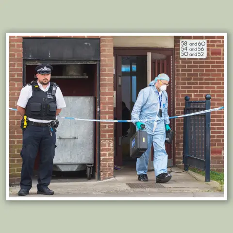 PA Media Police at Younis's flat