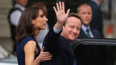 Getty Images David and Samantha Cameron leaving office