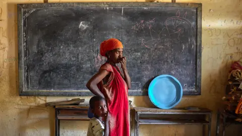 Getty Images A woman and child in a displacement centre in Tigray, Ethiopia - May 2023