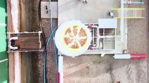 Cuadrilla aerial view of gas setting flames alight at the well