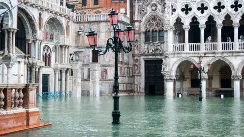 Getty Images St Mark's Square in Venice, Italy, is covered in water during an exceptional high tide, 13 November 2019