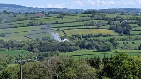 @dog_gruff Smoke seen rising over countryside