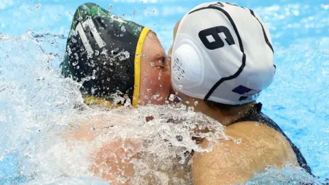Kiyoshi Ota/EPA-EFE/REX/Shutterstock Two women water polo players collide with their faces on 24 July 2023.