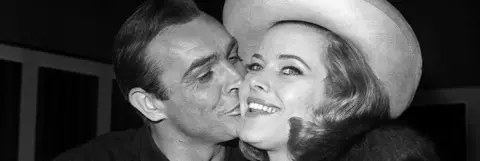 PA Media Honor Blackman (Pussy Galore) and Sir Sean Connery (James Bond) before filming of Goldfinger