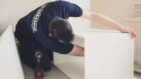 Fantastic Services Man doing repairs