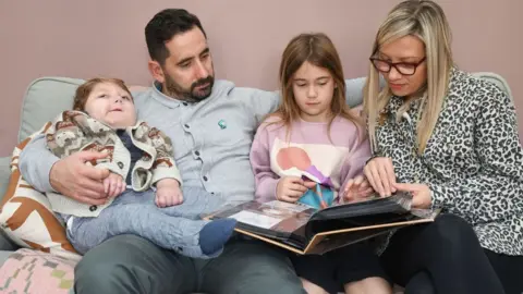 Acorns Hospice Reuben, dad Sam, Lydia, and Mum Jo