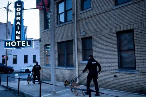 Getty Images Police sniffer dogs on Wednesday morning patrol the motel where King was killed