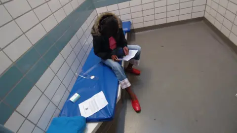 Woman in police cell