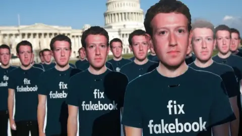 Getty Images Cardboard cut-outs of Mark Zuckerberg at a demonstration outside the US Capitol building in April 2018