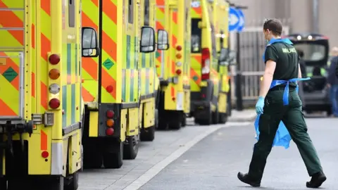 Stefan Rousseau/PA Wire Ambulance lined up at a hospital