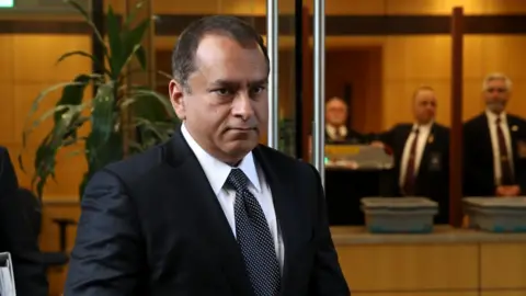 Getty Images Mr Balwani is photographed arriving at court