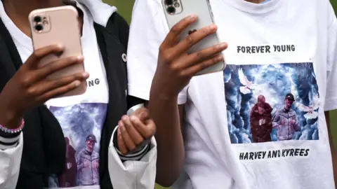 PA Media Mourners outside