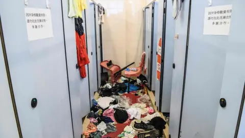 AFP Clothes are discarded in university bathrooms