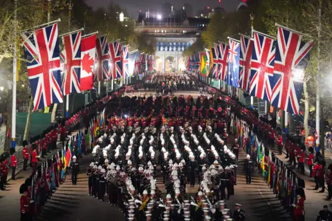 James Manning / PA A night time rehearsal in central London for the Coronation.