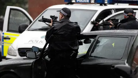 Getty Images Armed Merseyside police officer